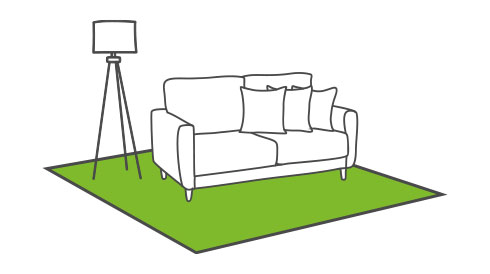 Wohnzimmer mit grünem Teppich